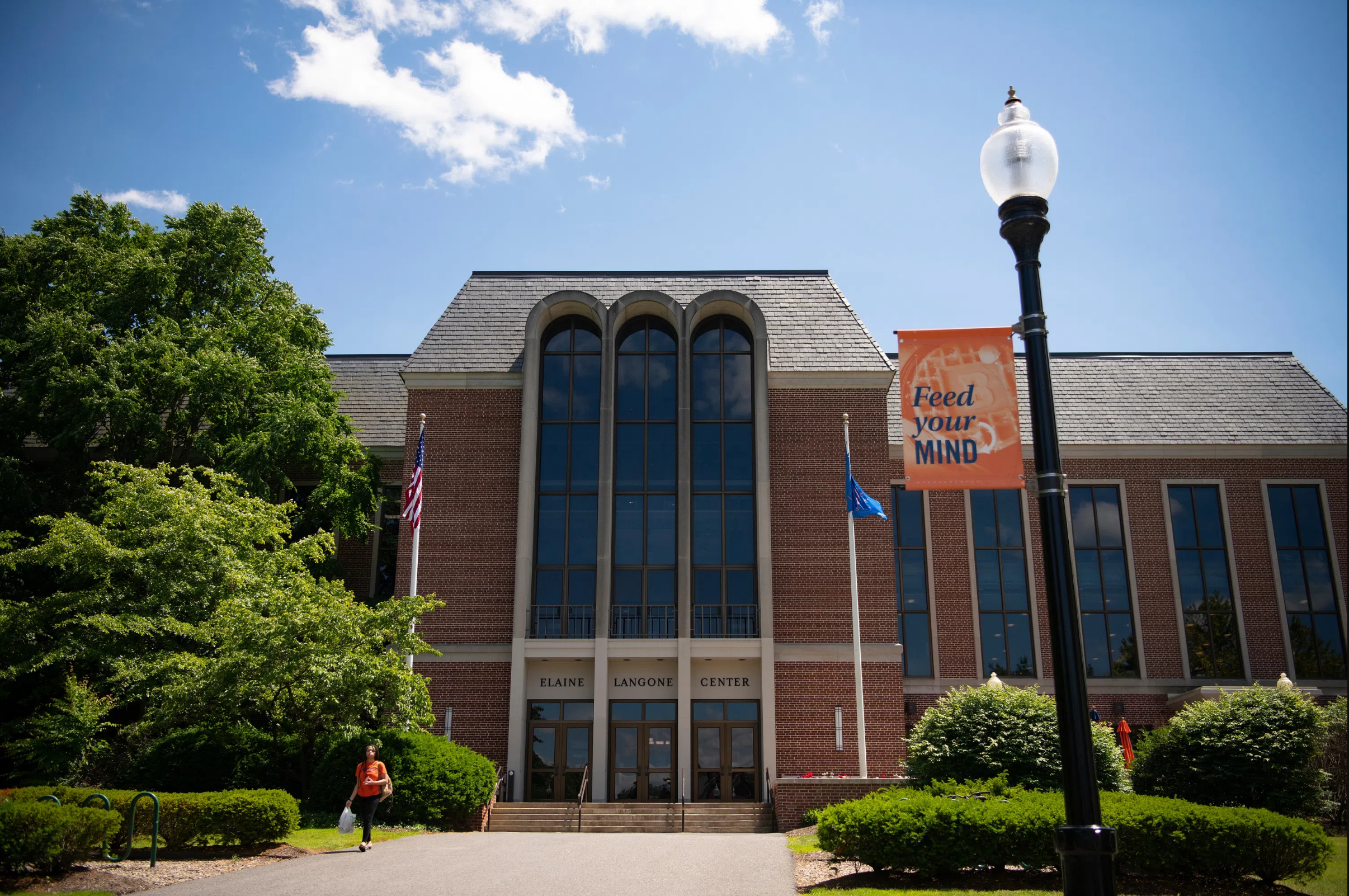 The Elaine Langone Center on Bucknell's campus, a multi-story brick building with tall window.