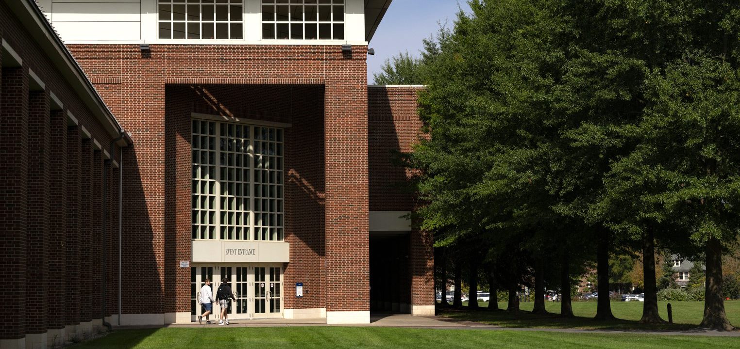 The Elaine Langone Center on Bucknell's campus, a multi-story brick building with tall window.